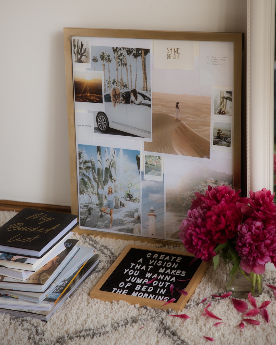 A vision board featuring travel inspirations and motivational quotes, surrounded by books and flowers, set in a cozy room.